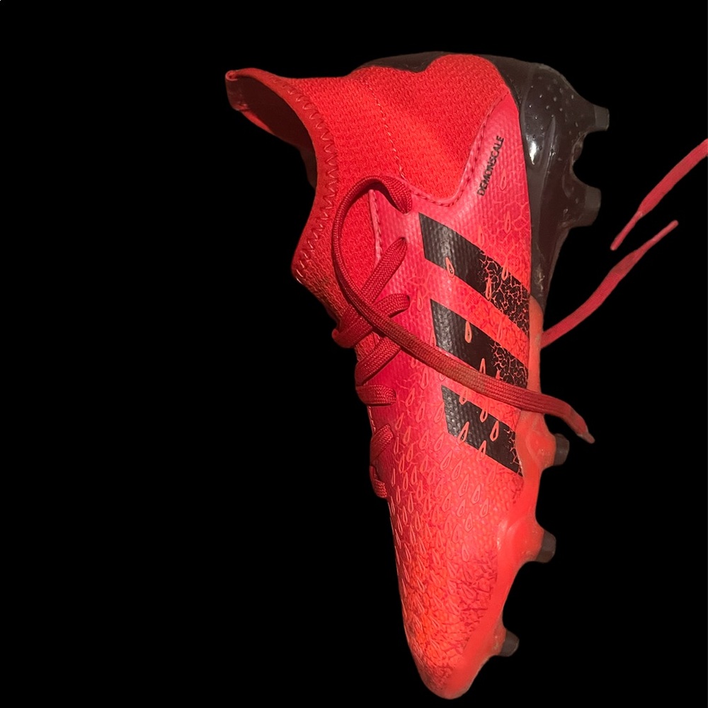 Red Adidas soccer cleats
